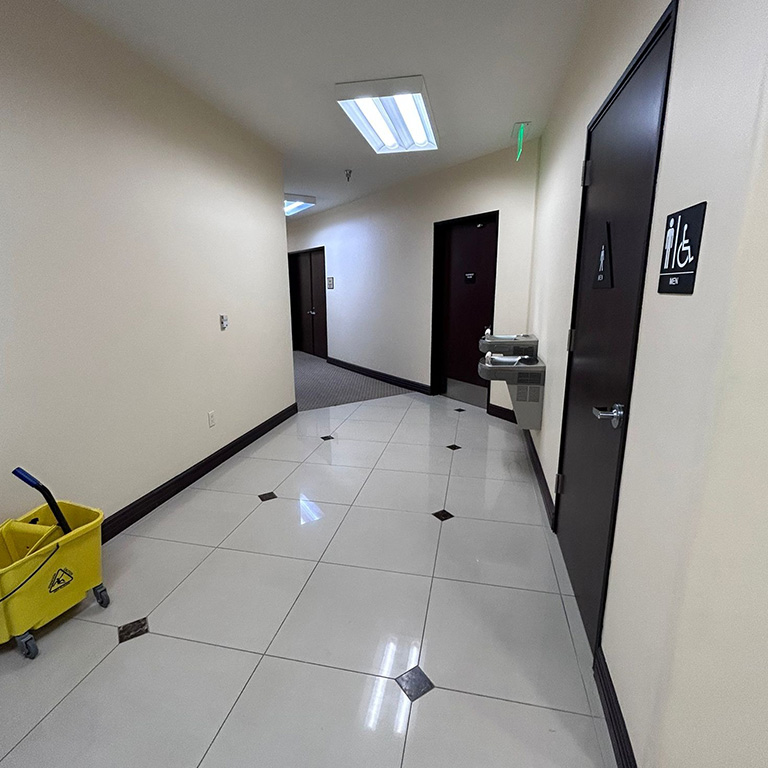 Commercial janitorial staff performing floor cleaning in Simi Valley business.